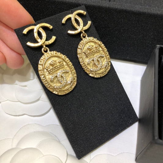 Vintage gold coin relief palace earrings