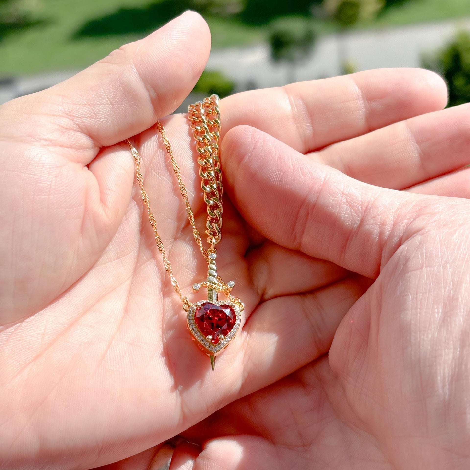 Heart and sword necklace